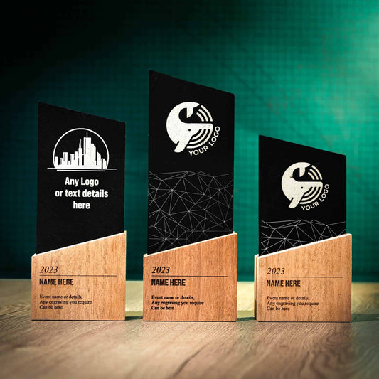 Three Wooden and Slate trophies, a range of Trophies called the Blade Award. The Blade trophies consist of an Eco-friendly base with a block of Welsh Snowdonian Slate rising out of it to an off-centre point. They are personalised with the details of the event and a logo.