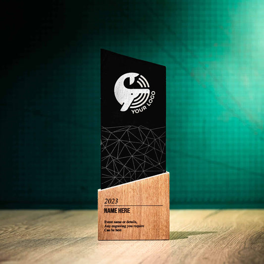 A large laser-engraved, eco-friendly, wooden and slate trophy called The Blade Award. The Blade trophies consist of an Eco-friendly base with a block of Welsh Snowdonian Slate rising out of it to an off-centre point. They are personalised with the details of the event and a logo.