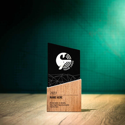 A small laser-engraved, eco-friendly, wooden and slate trophy called The Blade Award. The Blade trophies consist of an Eco-friendly base with a block of Welsh Snowdonian Slate rising out of it to an off-centre point. They are personalised with the details of the event and a logo.