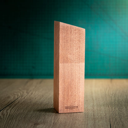 The back of an eco-friendly wooden trophy, the Boron Award. 