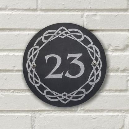 A laser-engraved, silver colour-filled, round slate house sign with a Celtic border. Circle 3.75", 6" or 9"