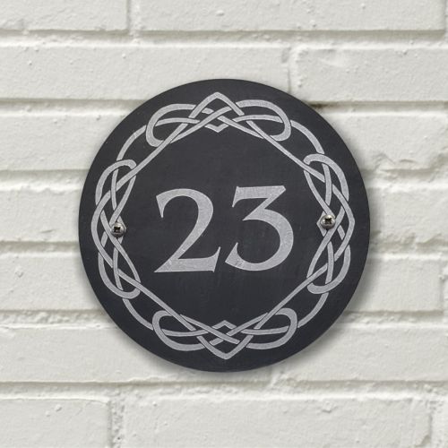 A laser-engraved, silver colour-filled, round slate house sign with a Celtic border. Circle 3.75", 6" or 9"