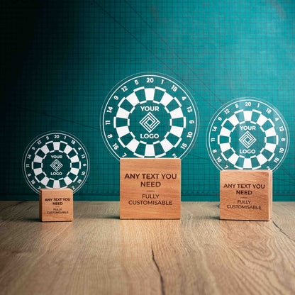 Three darts trophies with custom text and logos, on eco-friendly wooden bases, with a clear Perspex darts board mounted on top, featuring fully customisable areas for text and logos.