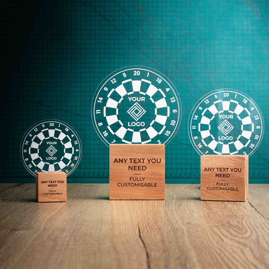 Three darts trophies with custom text and logos, on eco-friendly wooden bases, with a clear Perspex darts board mounted on top, featuring fully customisable areas for text and logos.