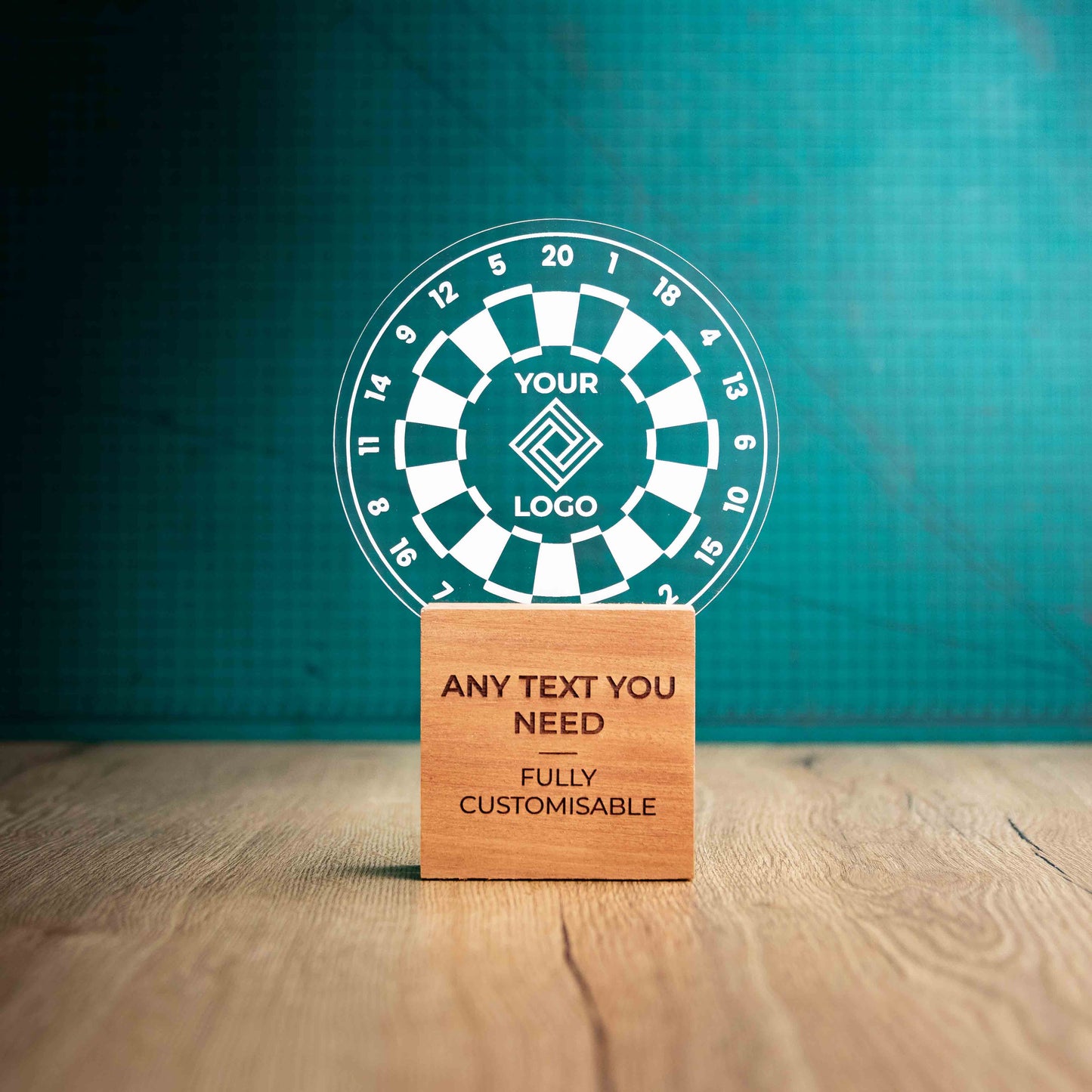 A large Darts trophy with custom text and logos, on an eco-friendly wooden base, with a clear Perspex Darts board mounted on top, featuring fully customisable areas for text and logos.