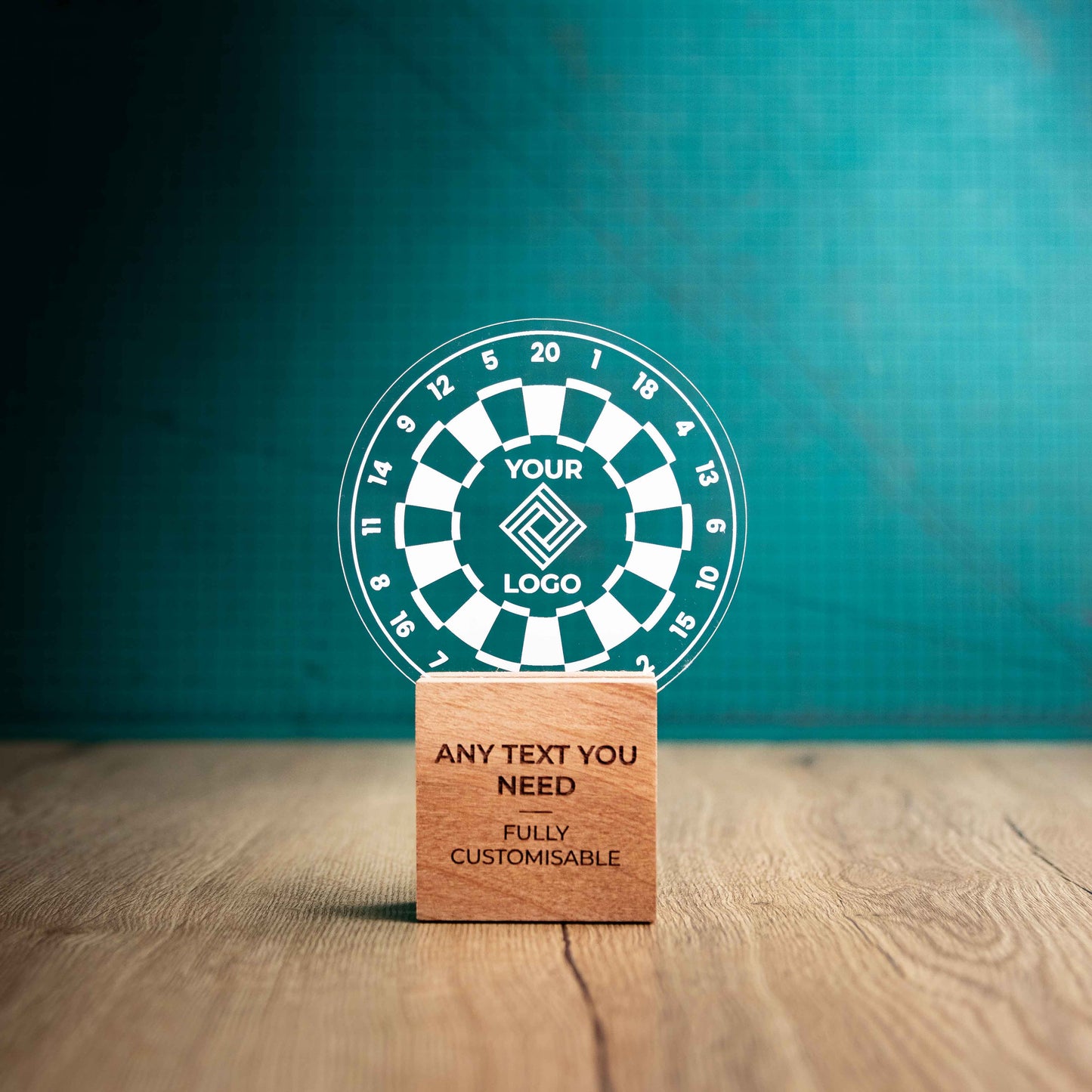 A medium Darts trophy with custom text and logos, on an eco-friendly wooden base, with a clear Perspex Darts board mounted on top, featuring fully customisable areas for text and logos.