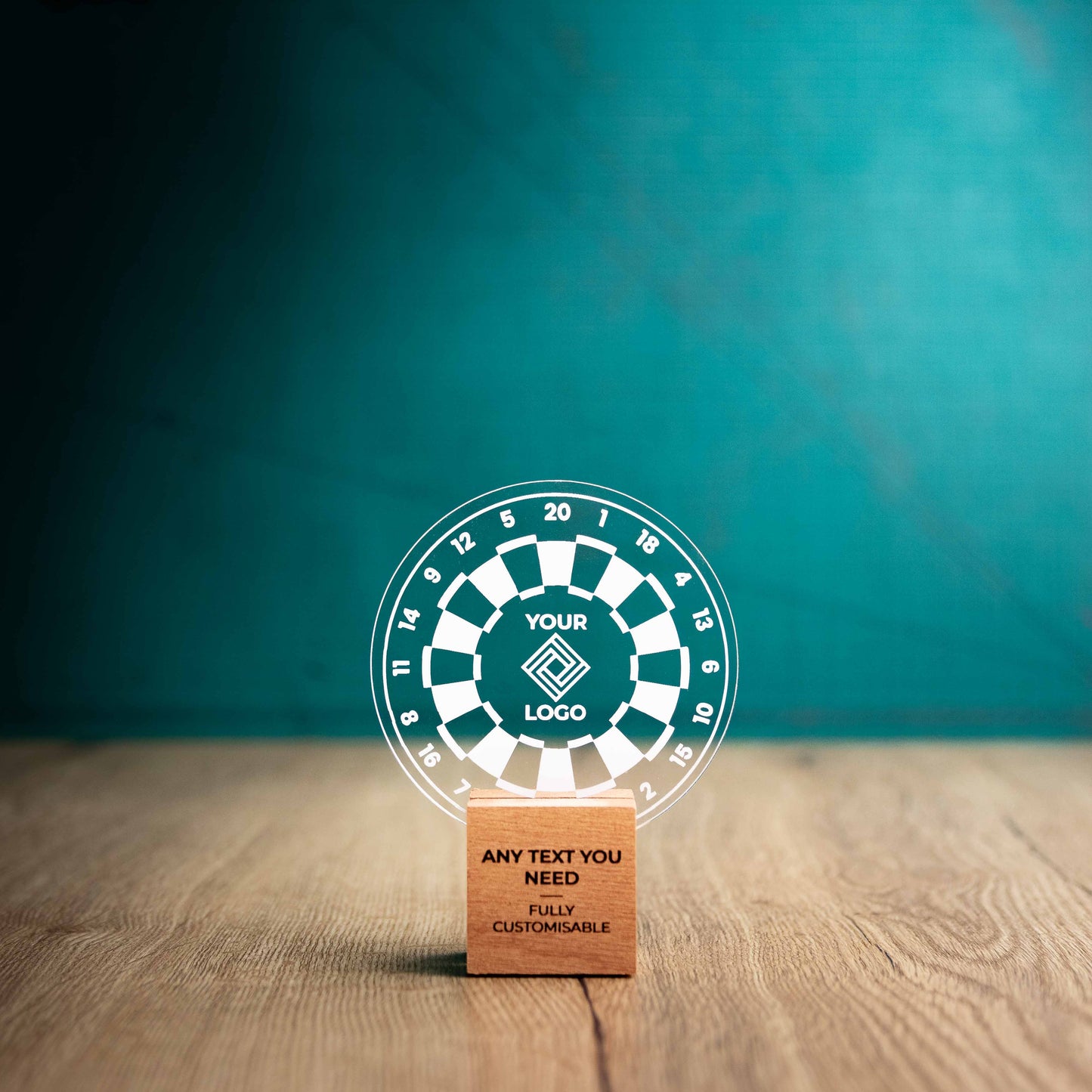 A small Darts trophy with custom text and logos, on an eco-friendly wooden base, with a clear Perspex Darts board mounted on top, featuring fully customisable areas for text and logos.