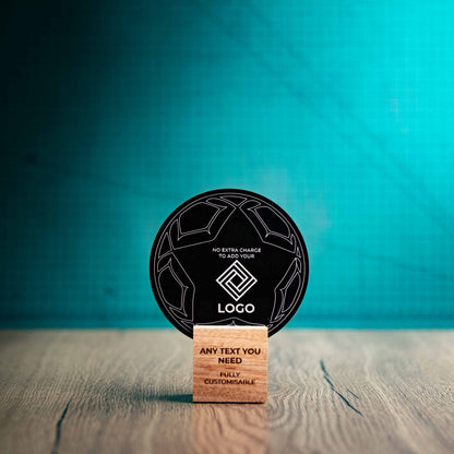 A small football trophy with custom text and logos, on an eco-friendly wooden base, with a black Perspex football mounted on top, featuring fully customisable areas for text and logos.
