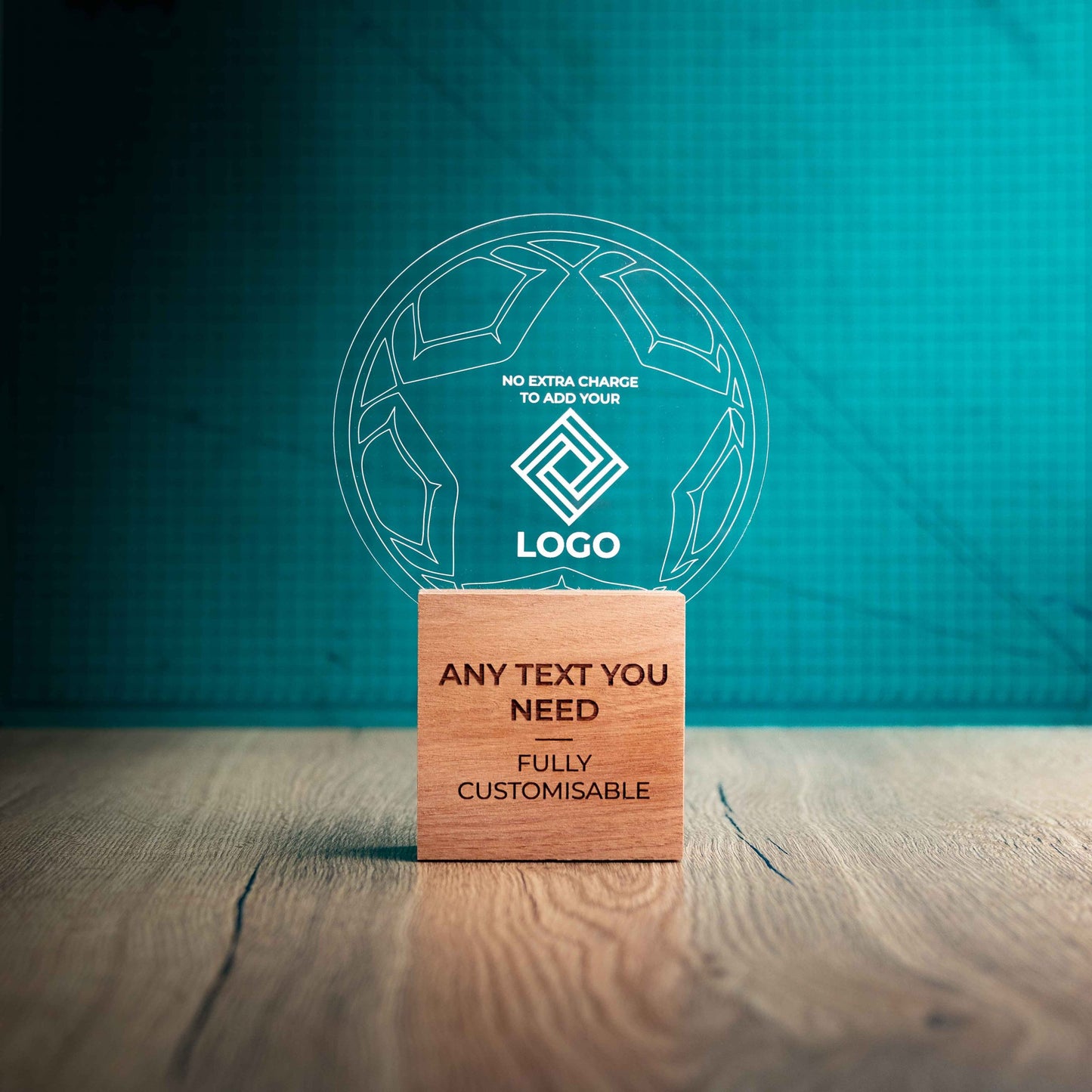 A large football trophy with custom text and logos, on an eco-friendly wooden base, with a clear Perspex football mounted on top, featuring fully customisable areas for text and logos.