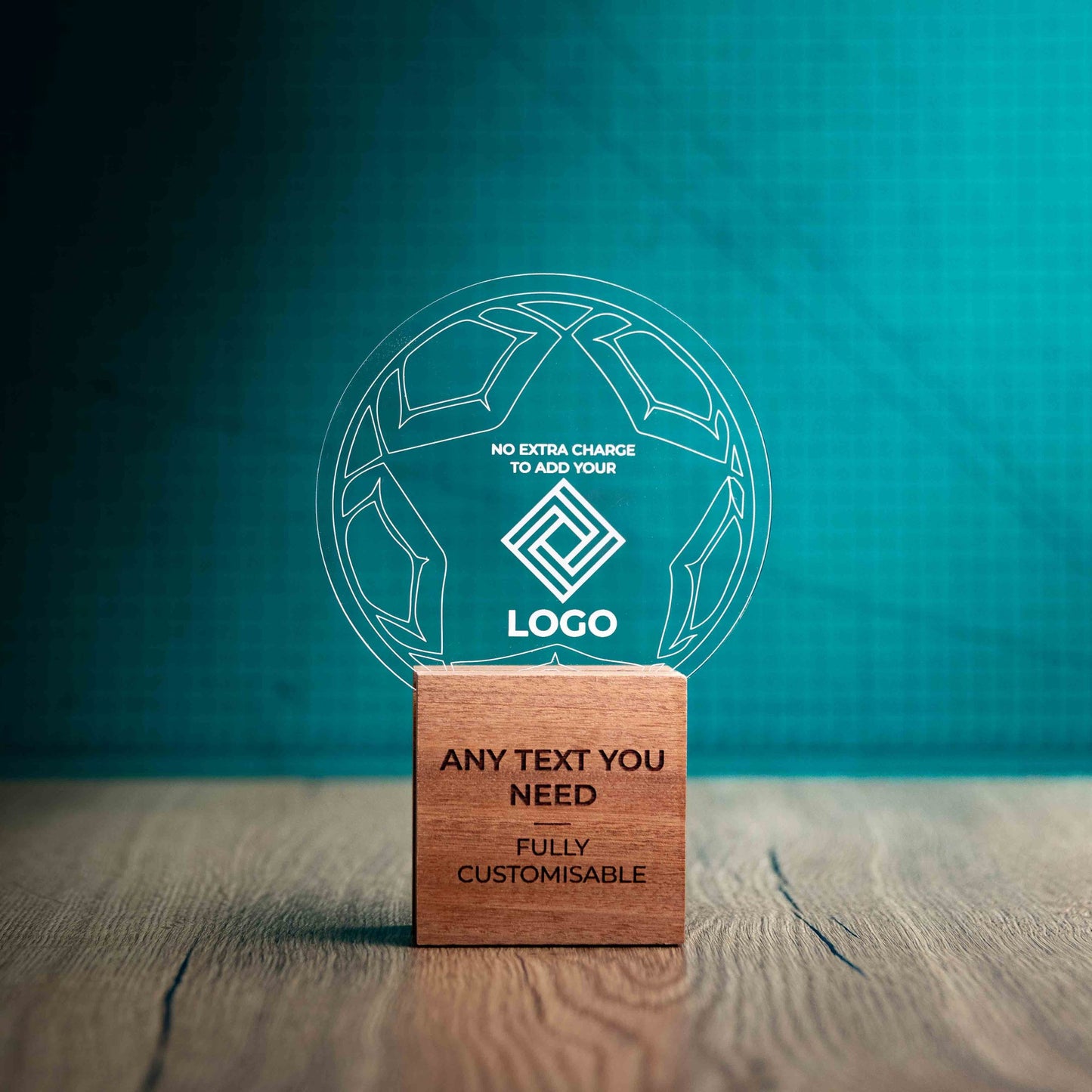 A medium football trophy with custom text and logos, on an eco-friendly wooden base, with a clear Perspex football mounted on top, featuring fully customisable areas for text and logos.