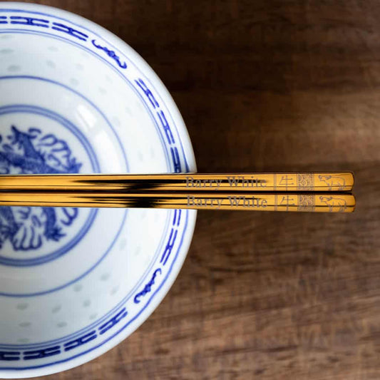 A pair of personalised Gold Chinese Zodiac Chopsticks, Bull, laser engraved with a name of your choice