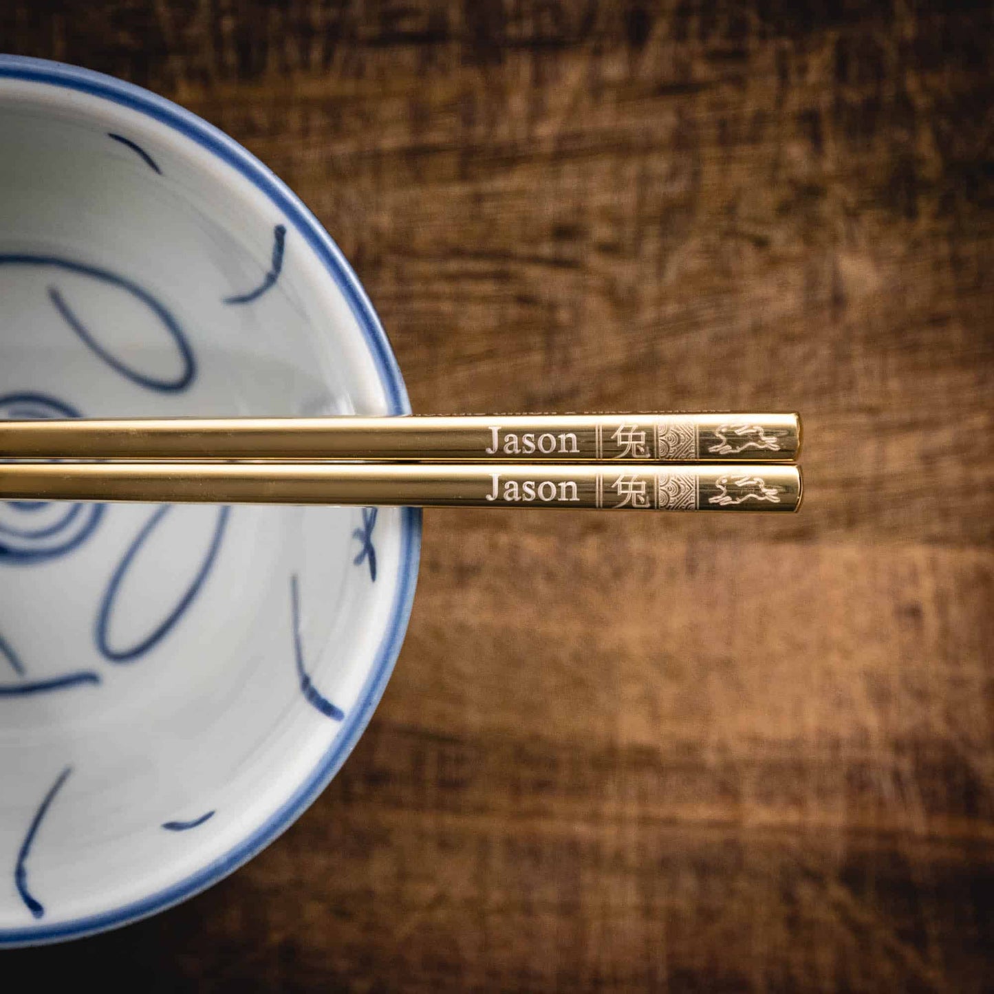 A pair of personalised Gold Chinese Zodiac Chopsticks, Rabbit, laser engraved with a name of your choice