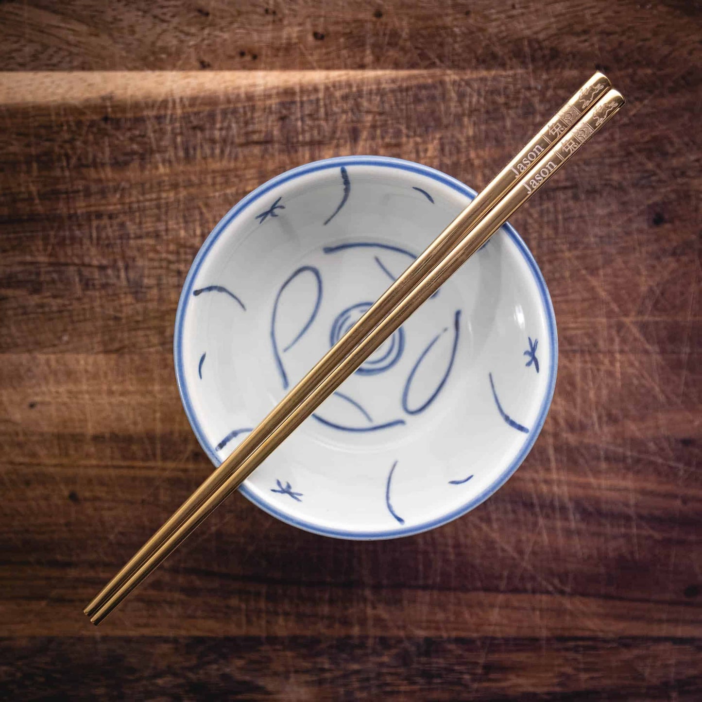 A pair of personalised Gold Chinese Zodiac Chopsticks, Rabbit, laser engraved with a name of your choice