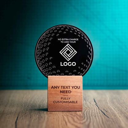 A medium golf award trophy with custom text and logos, on an eco-friendly wooden base, with a black Perspex golf ball mounted on top, with fully customisable areas featuring fully customisable areas for text and logos.