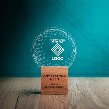 A medium golf award trophy with custom text and logos, on an eco-friendly wooden base, with a clear Perspex golf ball mounted on top, with fully customisable areas featuring fully customisable areas for text and logos.