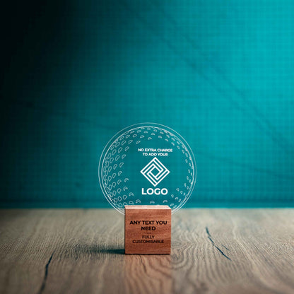 A small golf award trophy with custom text and logos, on an eco-friendly wooden base, with a clear Perspex golf ball mounted on top, with fully customisable areas featuring fully customisable areas for text and logos.