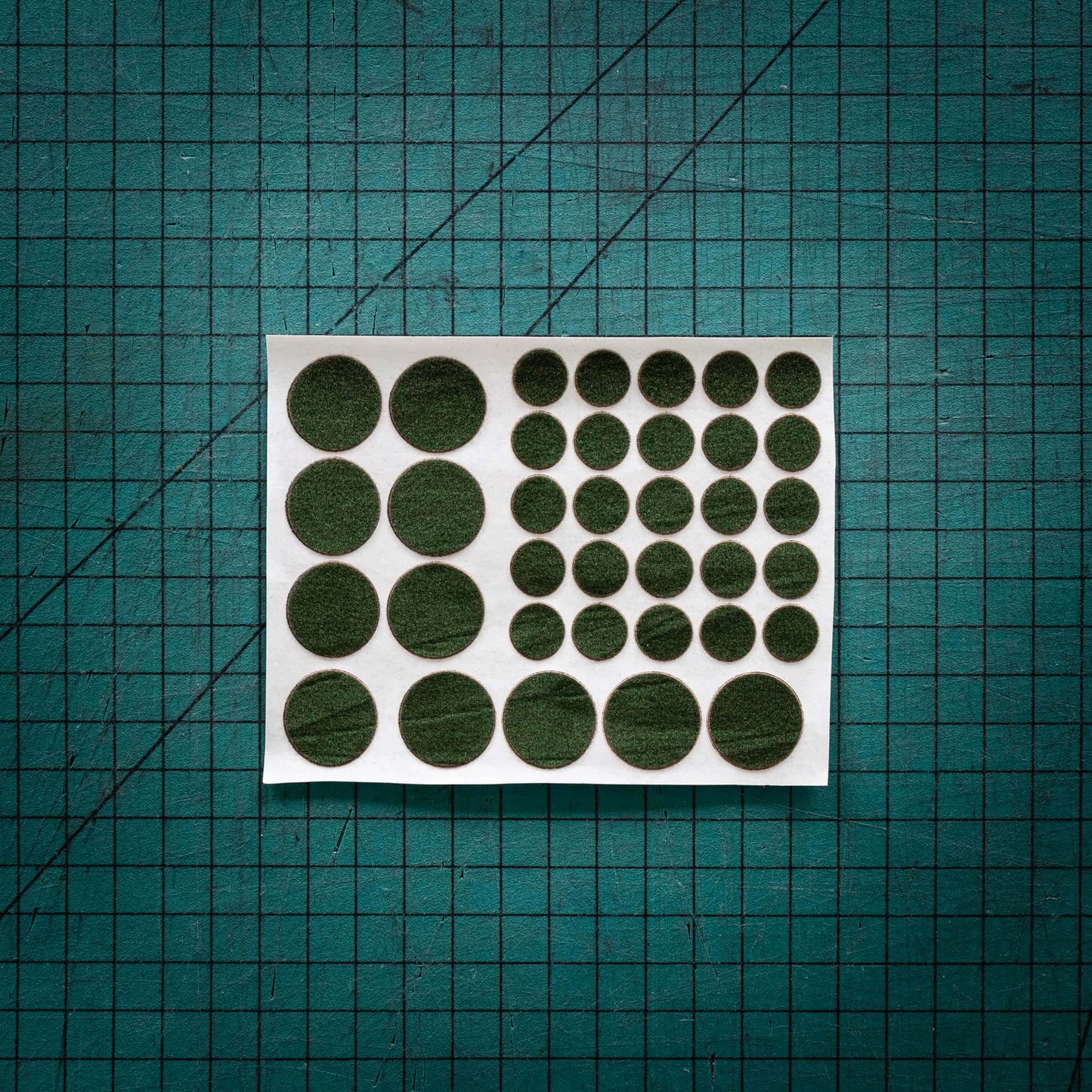Green baize circles, sometimes known as felt, laser cut to various sizes.