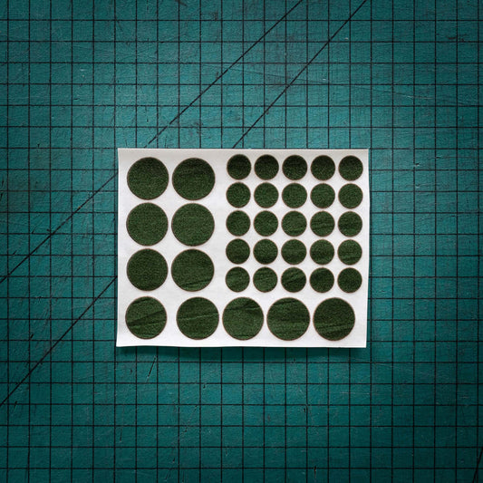 Green baize circles, sometimes known as felt, laser cut to various sizes.