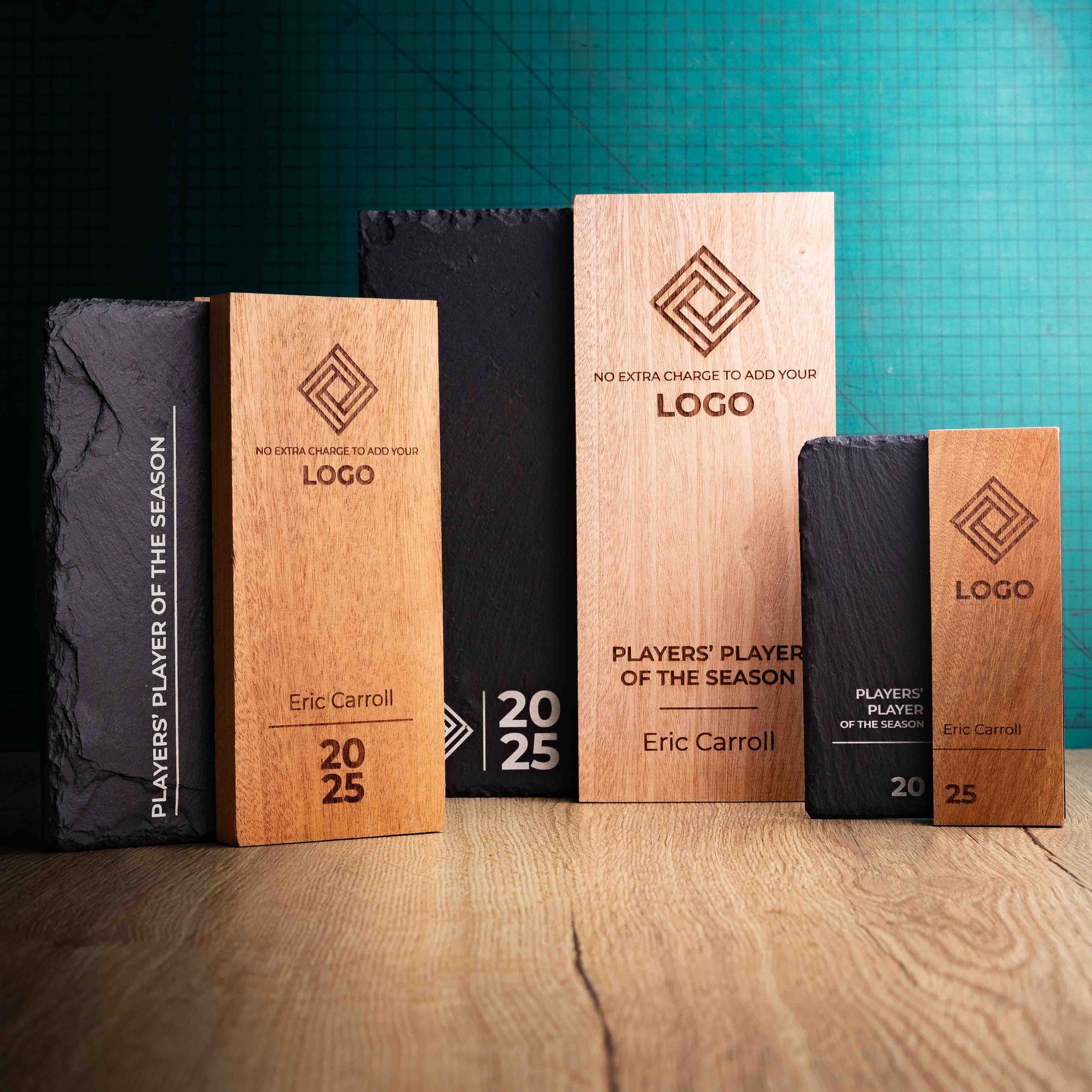 The Henge Award range, small, medium and large. A range of laser-engraved, eco-friendly wooden and slate trophies, made of two pieces of Sapele wood with a piece of natural Snowdonian slate.