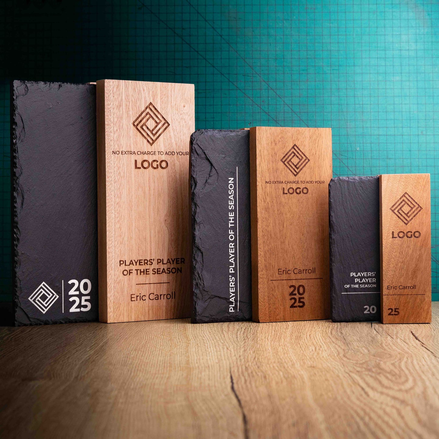 The Henge Award range, small, medium and large. A range of laser-engraved, eco-friendly wooden and slate trophies, made of two pieces of Sapele wood with a piece of natural Snowdonian slate.