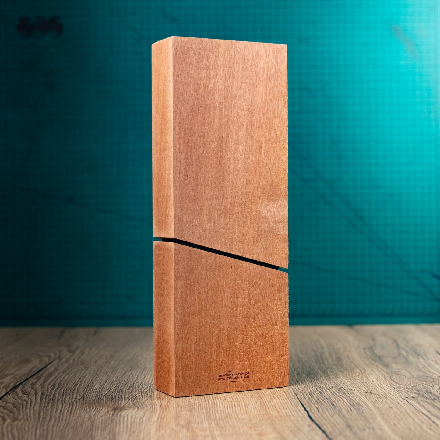 The back of the Imperial Award, an Eco-friendly wooden trophy with 'responsibly sourced wood' text and www.lasersareus.com on a wooden surface.