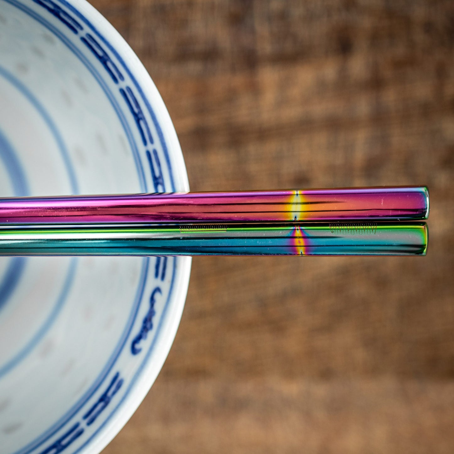 A pair of Chinese-style Metal Coloured Chopsticks - Iridencence. Each pair is personalised with either a name or a phrase.