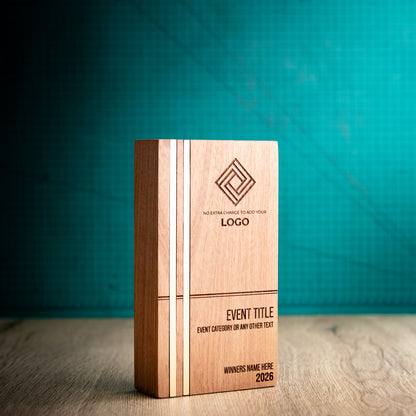 Three-quarter view of the large Kingdom wooden trophy showing its depth and rounded vertical edges, with two full-height gold metallic inlays flush with the left side of the engraved front face.