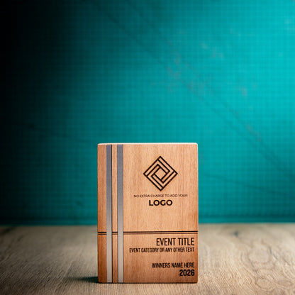 Front view of the medium Kingdom wooden trophy with two parallel silver metallic inlays set flush into the full height of the left side, plus engraved logo, event details, winner name and year.