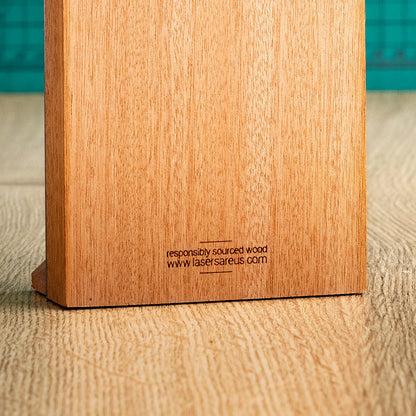 An Eco-friendly wooden trophy with 'responsibly sourced wood' text and www.lasersareus.com on a wooden surface.