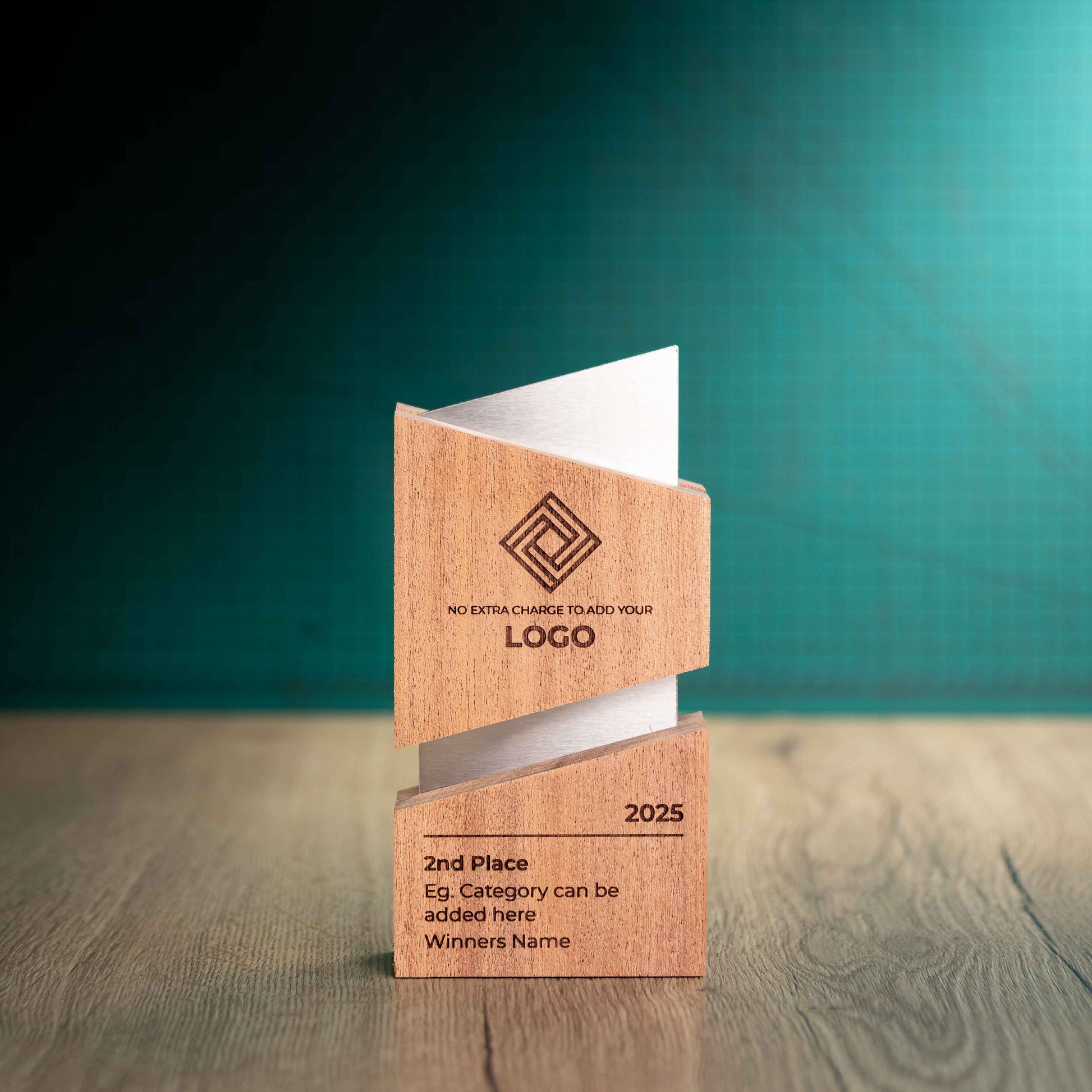 An eco-friendly wooden and metal Trophy called Lasdun, size - medium. A trophy with two pieces of sustainably sourced Sapele wood paired with precision-cut stainless steel running through the middle