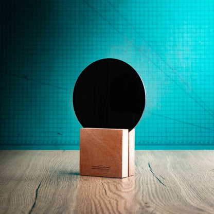 A back view of a medium Legacy trophy with custom text and logos, on an eco-friendly wooden base, with a black Perspex circle mounted on top, featuring fully customisable areas for text and logos.