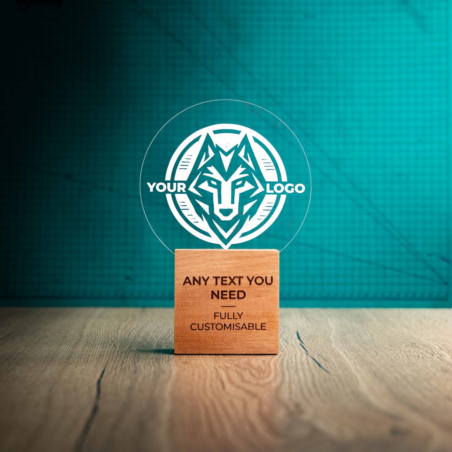 A large Legacy trophy with custom text and logos, on an eco-friendly wooden base, with a clear Perspex circle mounted on top, featuring fully customisable areas for text and logos.