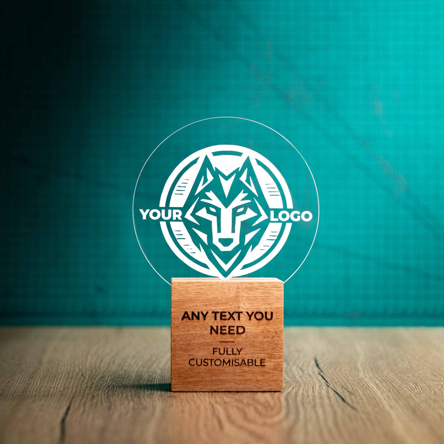 A medium Legacy trophy with custom text and logos, on an eco-friendly wooden base, with a clear Perspex circle mounted on top, featuring fully customisable areas for text and logos.