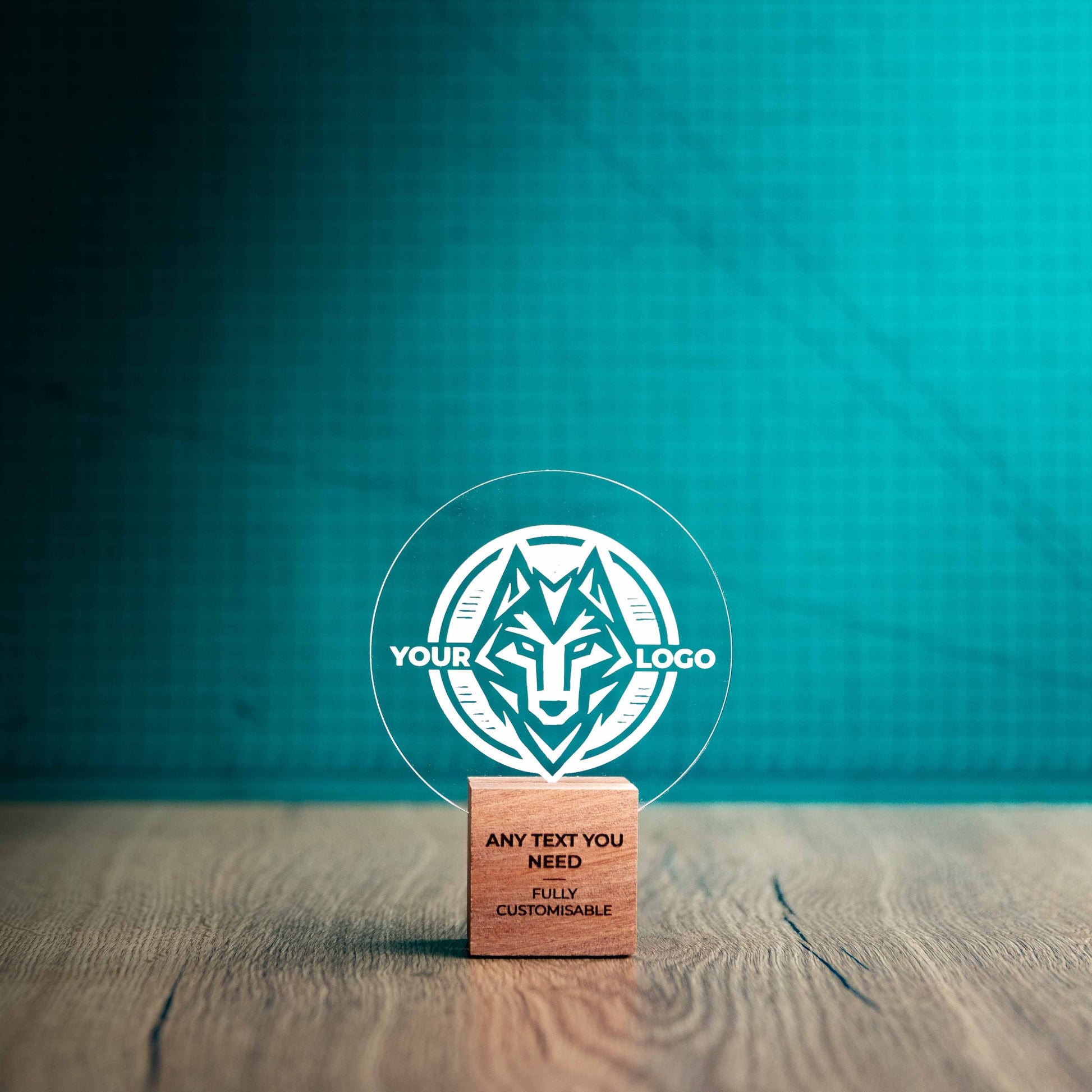 A small Legacy trophy with custom text and logos, on an eco-friendly wooden base, with a clear Perspex circle mounted on top, featuring fully customisable areas for text and logos.