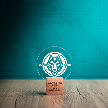 A small Legacy trophy with custom text and logos, on an eco-friendly wooden base, with a clear Perspex circle mounted on top, featuring fully customisable areas for text and logos.