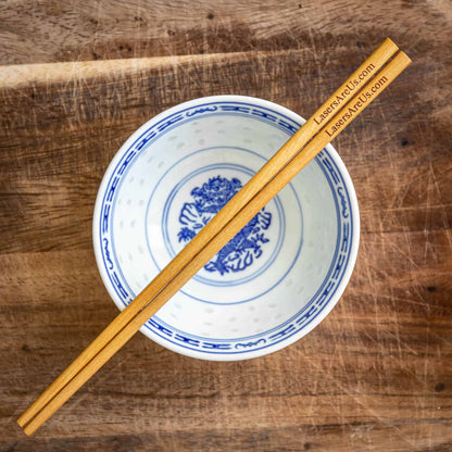 A pair of personalised dark wood Chinese Chopsticks, personalised with a Company Logo