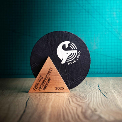 A Medium Luna Award, a laser-engraved, eco-friendly, wooden and slate trophy that is round with a triangular wooden base. 