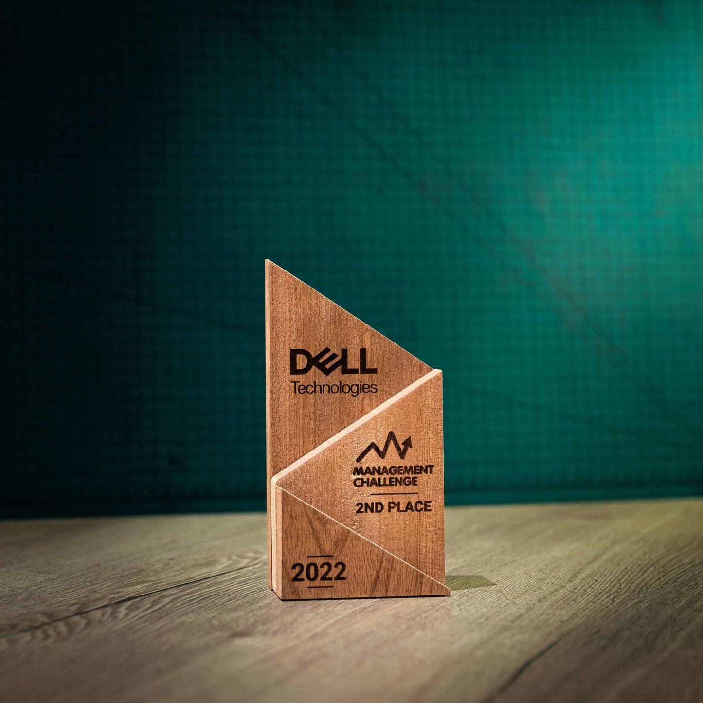 A medium laser-engraved, eco-friendly, Peak wooden trophy.