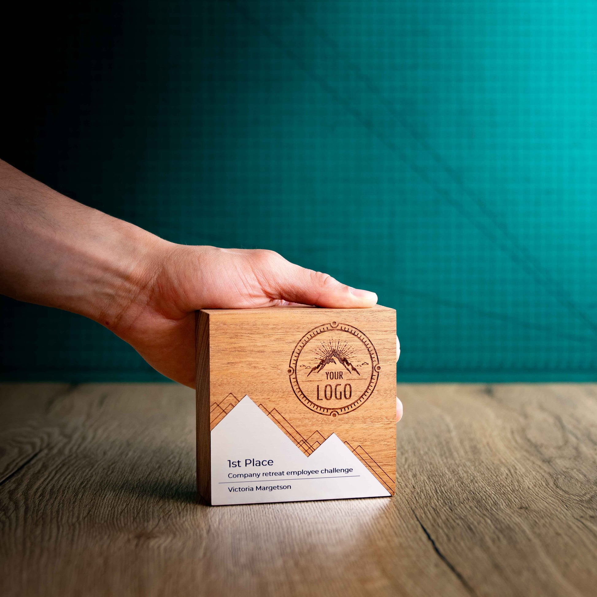 The Mesa Award, a square block eco-friendly wooden trophy with a mountain-like metallic laminate front.