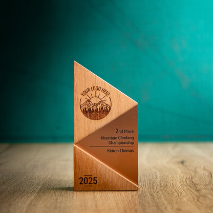 A Medium Metallic Peak Trophy. An eco-friendly personalised wooden trophy with a bronze acrylic accent. A Triangular wooden trophy laser-engraved with a logo and trophy personalisation.