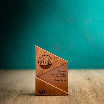 A Small Metallic Peak Trophy. An eco-friendly personalised wooden trophy with a bronze acrylic accent. A Triangular wooden trophy laser-engraved with a logo and trophy personalisation.