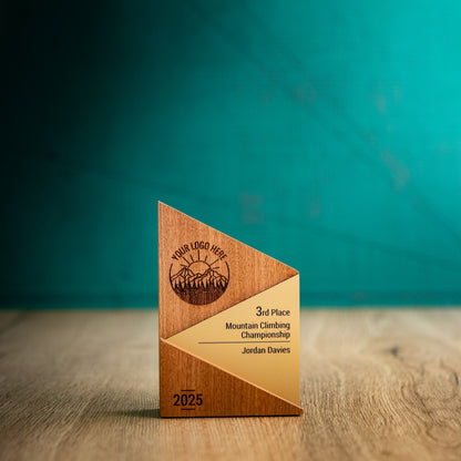 A Small Metallic Peak Trophy. An eco-friendly personalised wooden trophy with a gold acrylic accent. A Triangular wooden trophy laser-engraved with a logo and trophy personalisation.