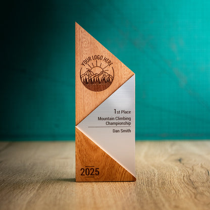 A Large Metallic Peak Trophy. An eco-friendly personalised wooden trophy with a silver acrylic accent. A Triangular wooden trophy laser-engraved with a logo and trophy personalisation.