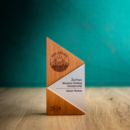 A Medium Metallic Peak Trophy. An eco-friendly personalised wooden trophy with a silver acrylic accent. A Triangular wooden trophy laser-engraved with a logo and trophy personalisation.