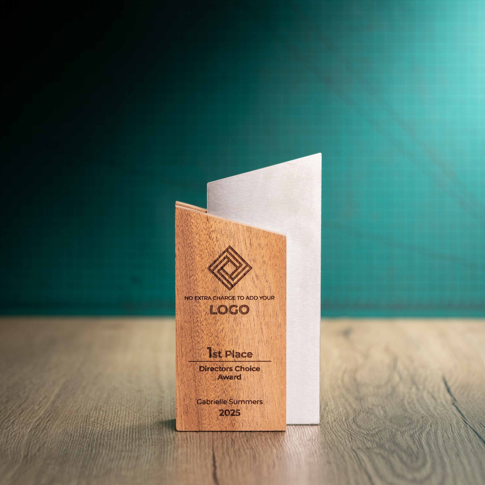 An eco-friendly wooden and metal Trophy called Monach, size medium. A trophy with a wooden block of sustainably sourced Sapele wood paired with precision-cut stainless steel.