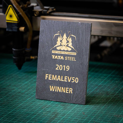A small, natural, colour-filled slate trophy