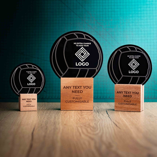 Three Netball trophies with custom text and logos, on eco-friendly wooden bases, with a black Perspex Netball mounted on top, featuring fully customisable areas for text and logos.