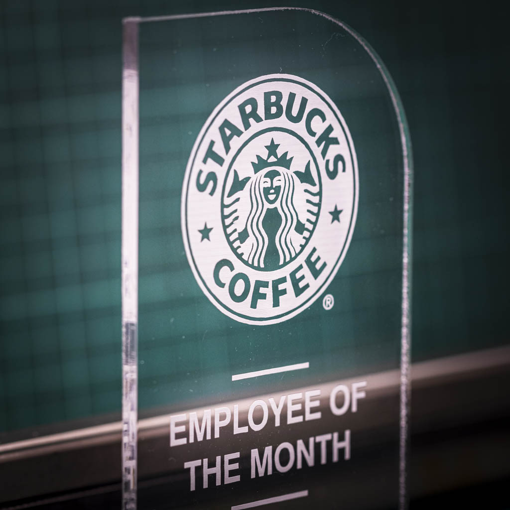 A personalised laser engraving on a perspex trophy