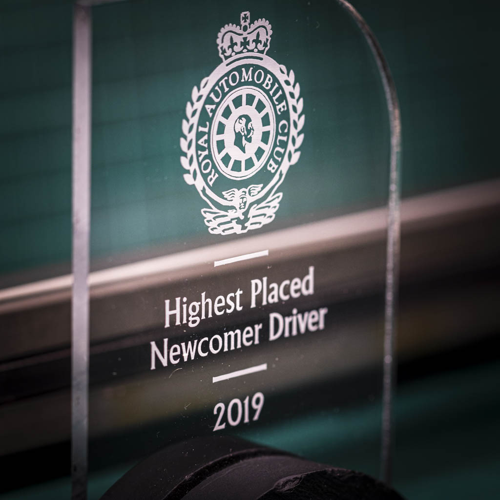A personalised laser engraving on a perspex trophy