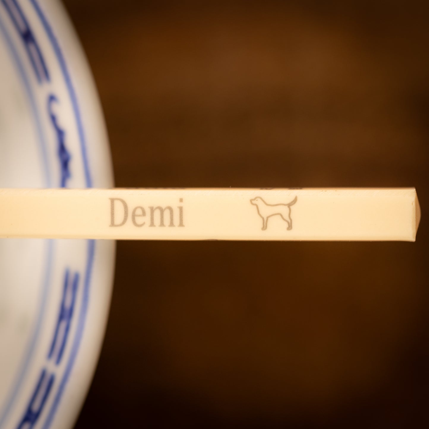 Cream coloured plastic melamine personalised chopsticks engraved with a name and Chinese Zodiac Animal, The Year of the Dog.